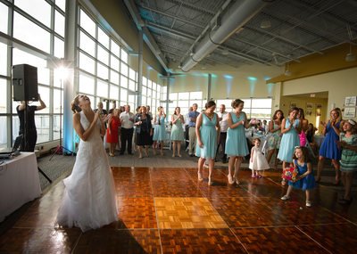 Bouquet Toss Caught by the Flower Girl